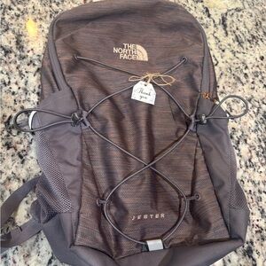 The North Face Jester Backpack with Adjustable Straps and Utility Pockets